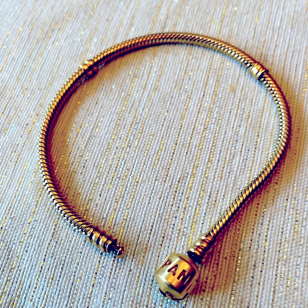 SOLD.Pandora real 14 k gold charm bracelet.sold